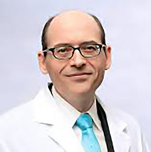 Dr. Michael Greger smiling and posing